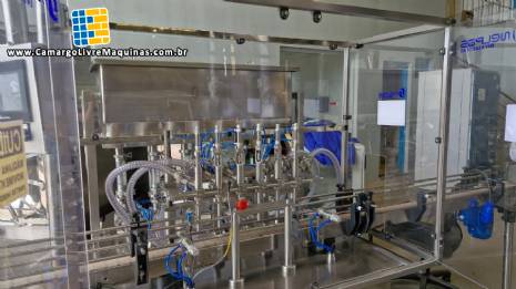 Linha completa de envase com envasadora rotuladora rosqueadora posicionador frascos Tecman Nelpas Tecnoenvase Tudela para l�quidos cosm�ticos