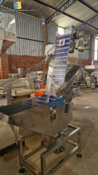 Alimentador posicionador abastecedor em a�o inox de tampas Norma